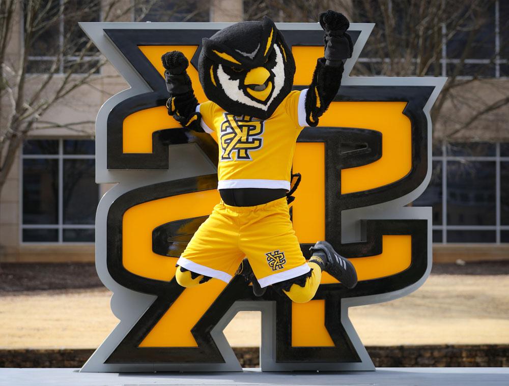 Scrappy jumping in front of the KS logo